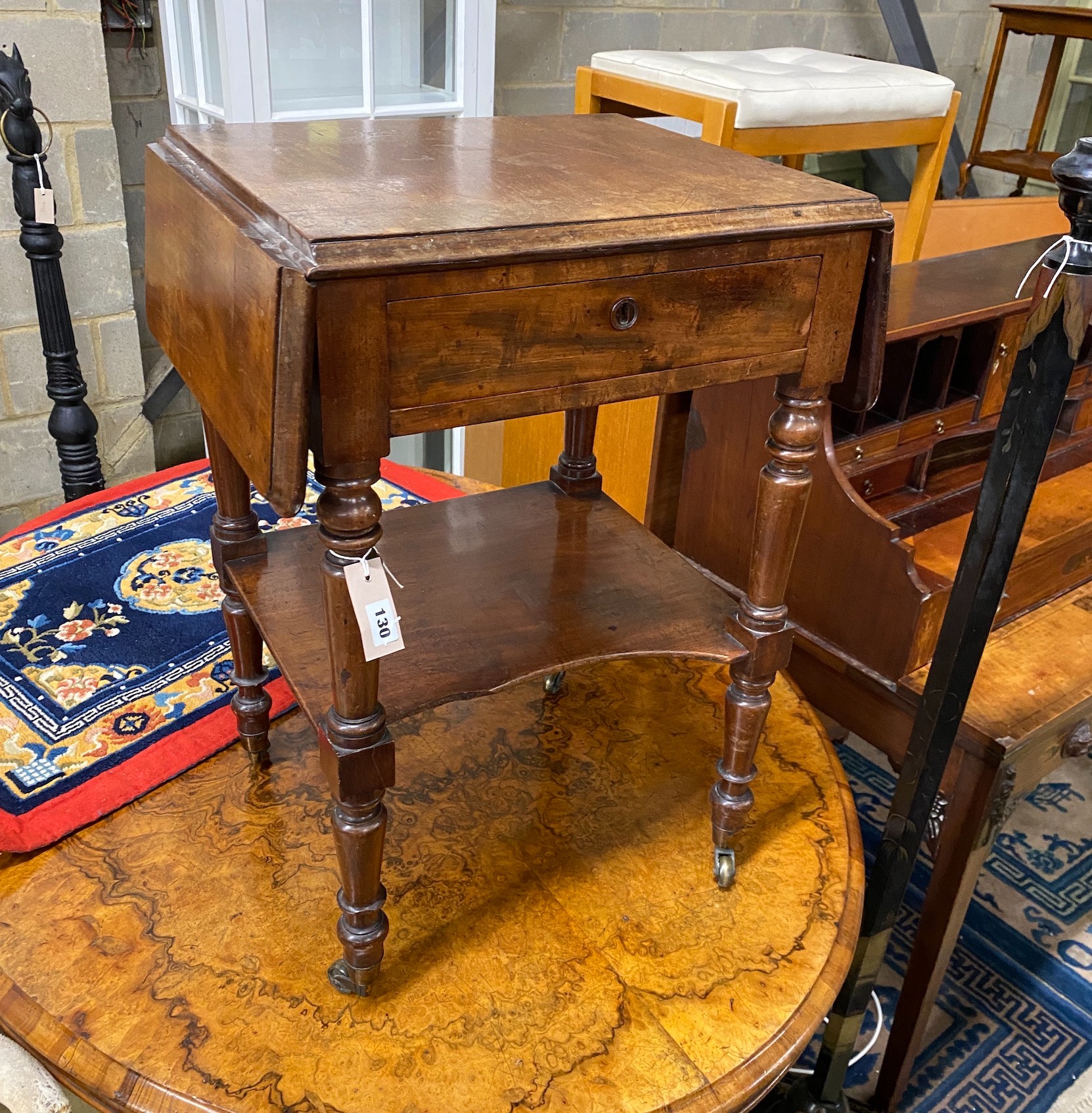A 19th century French mahogany drop flap two tier work table, width 50cm, depth 43cm, height 73cm
